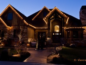 A standard Christmas light display with lights on the eaves.