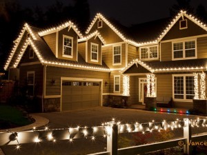 C9 Lights decorate the house while the fence is wrapped with mini lights.