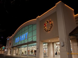 An Old Navy store decorated with Christmas lights.