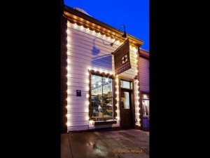 A Main Street retail shop celebrates Christmas with lights.