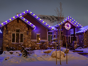 White and blue lights decorate this home in support of a favorite football team.
